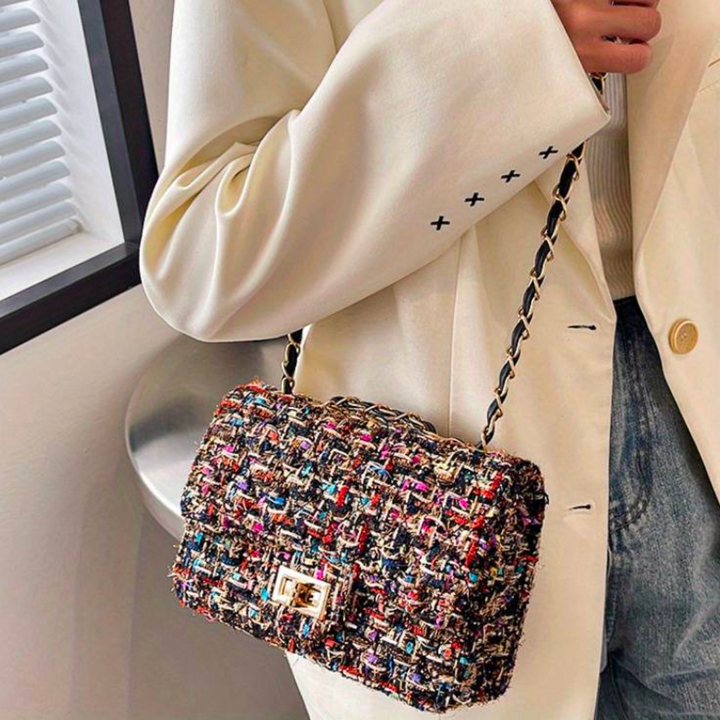 Compact structured bouclé shoulder bag for women with a sleek design and comfortable chain strap. All-year style.