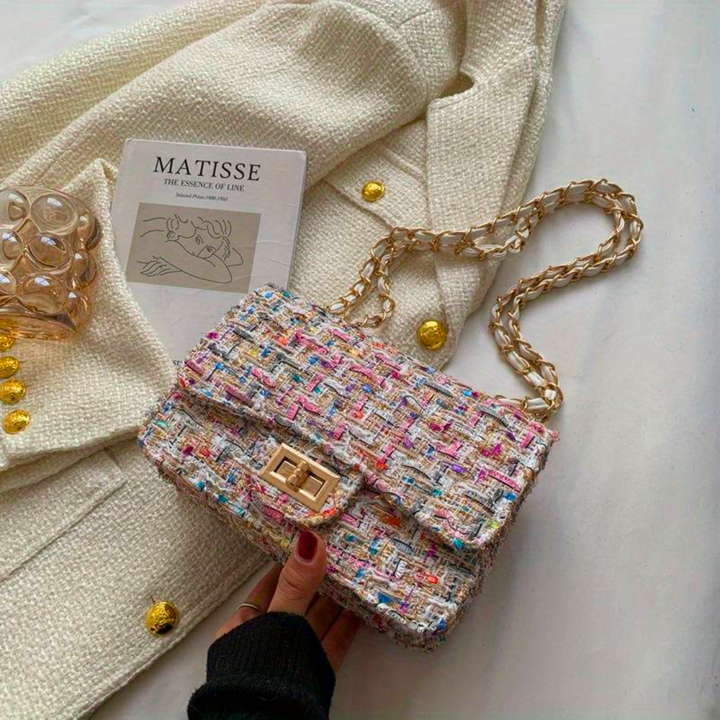 Stylish women's structured shoulder bag, a versatile accessory to elevate any outfit from casual to formal.