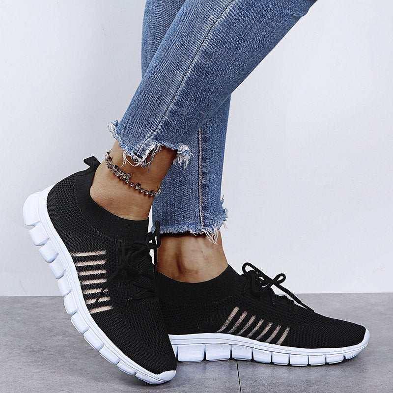 Comfortable women's fashion sneakers, side view, athletic sport style for versatile all-season wear.