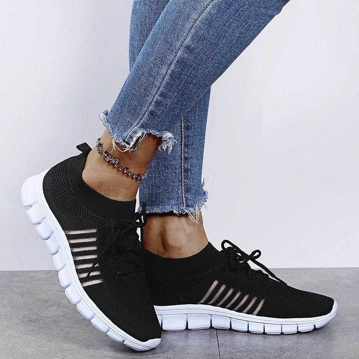Comfortable women's fashion sneakers, side view, athletic sport style for versatile all-season wear.