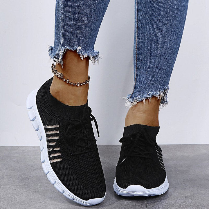 Close-up of breathable material on ladies' casual lace-up sneakers, ideal for comfortable, stylish everyday wear.