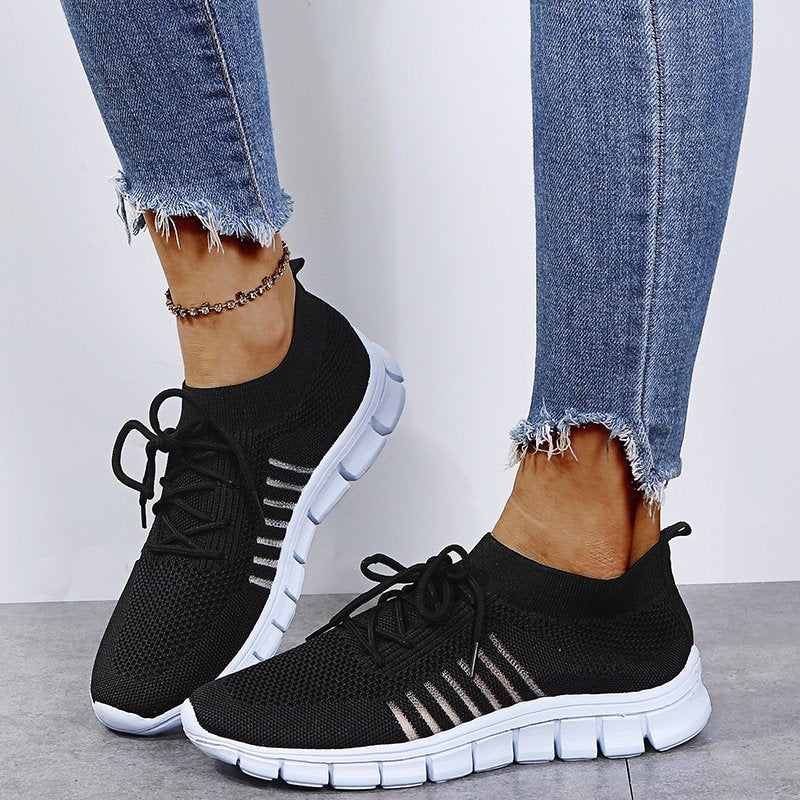 Ladies' versatile running shoes in a casual setting, comfortable and stylish athletic footwear for daily activities.