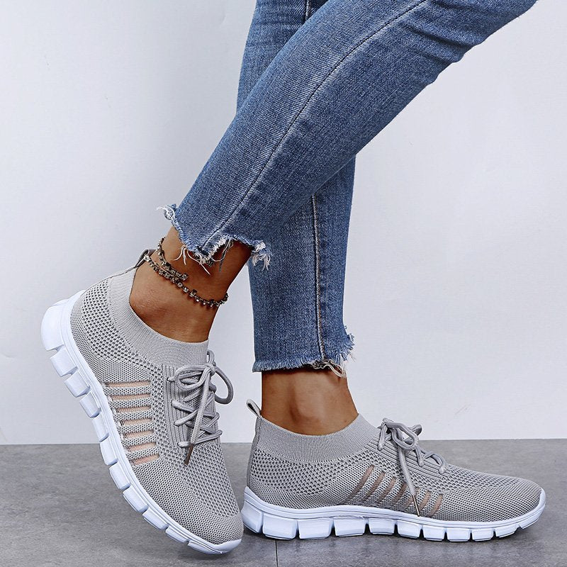 Stylish women's athletic sneakers, modern design offering versatile comfort for running & casual outings.