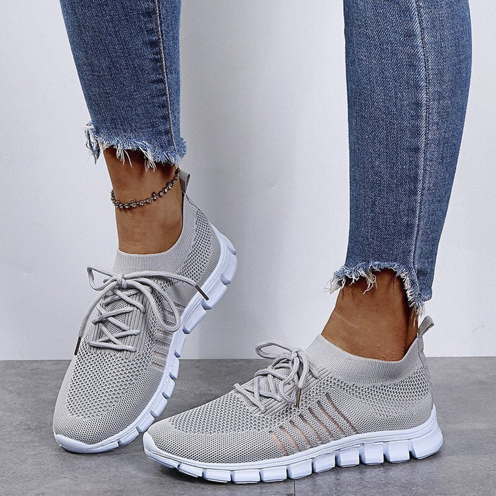 Top-down view of lace-up women's fashion sneakers, sleek design for versatile everyday style.