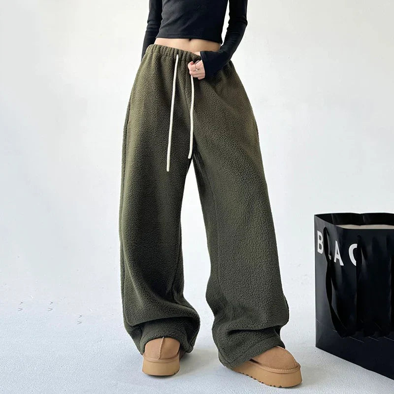 Trendy women's wide leg baggy sweatpants with high waist & drawstring, perfect for casual or athleisure fashion.