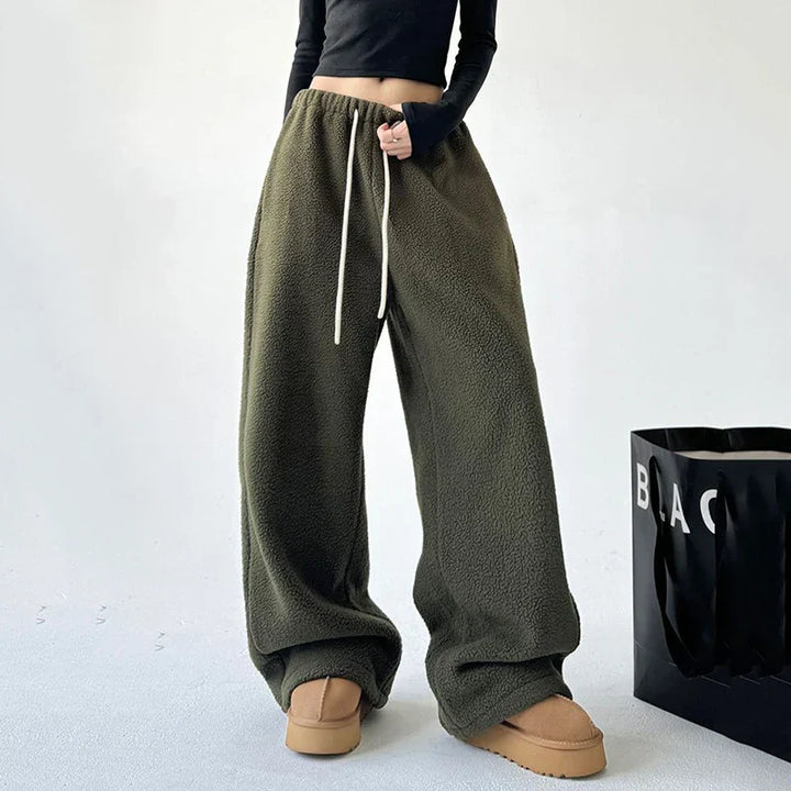 Trendy women's wide leg baggy sweatpants with high waist & drawstring, perfect for casual or athleisure fashion.