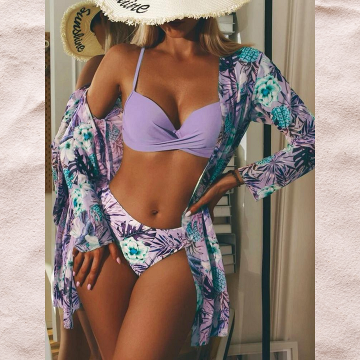 Women's high-waisted bikini set with twist front top & printed bottoms. Stylish two-piece swimwear for summer.