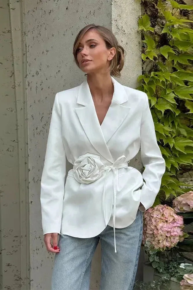 Elegant women's tailored wrap blazer with romantic rosette detail and chic tie belt. Perfect day to night feminine style.
