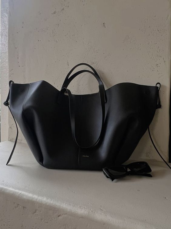 Front view of a chic black women's large work tote bag, a versatile professional purse.