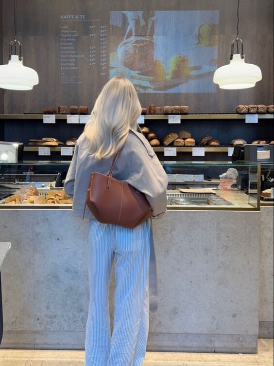 Interior of women's large work tote bag, showing spacious compartments for organization.