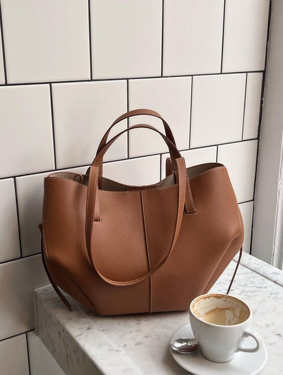 Women's large brown work tote bag, stylish & functional for professionals.