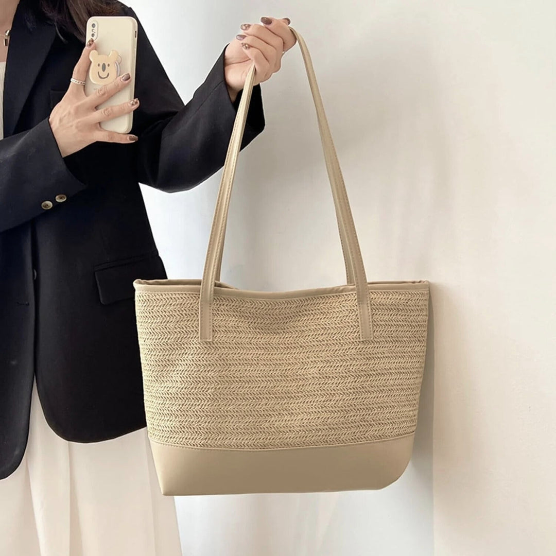 Large women's beige woven tote bag, perfect for casual everyday shoulder wear.