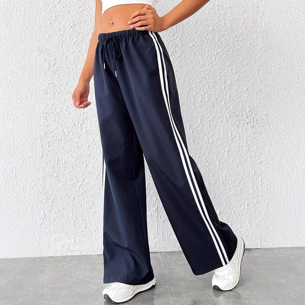 Versatile women's wide leg track pants in palazzo style with side stripe. Perfect for casual wear & loungewear.