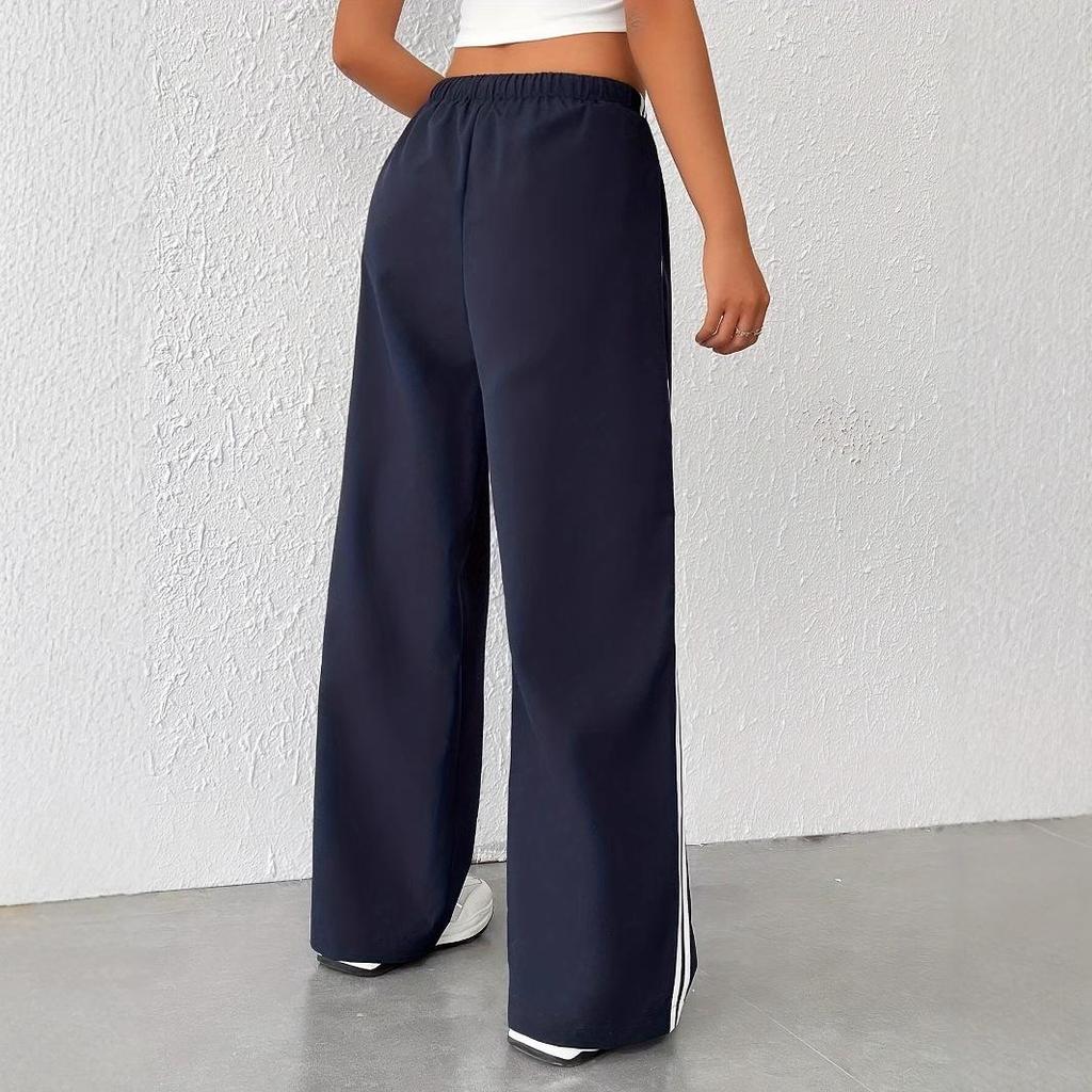Women's stylish wide leg track pants with sporty side stripe detail. Relaxed palazzo fit for ultimate comfort.