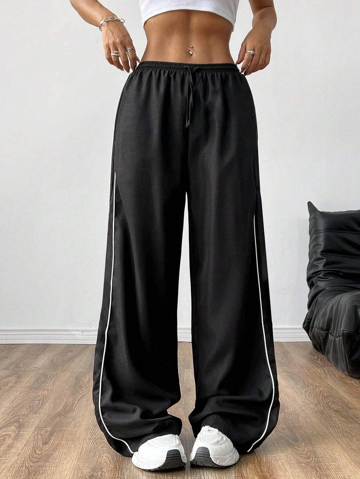 Comfortable women's baggy fit trackpants with adjustable drawstring waist for loose, relaxed loungewear.
