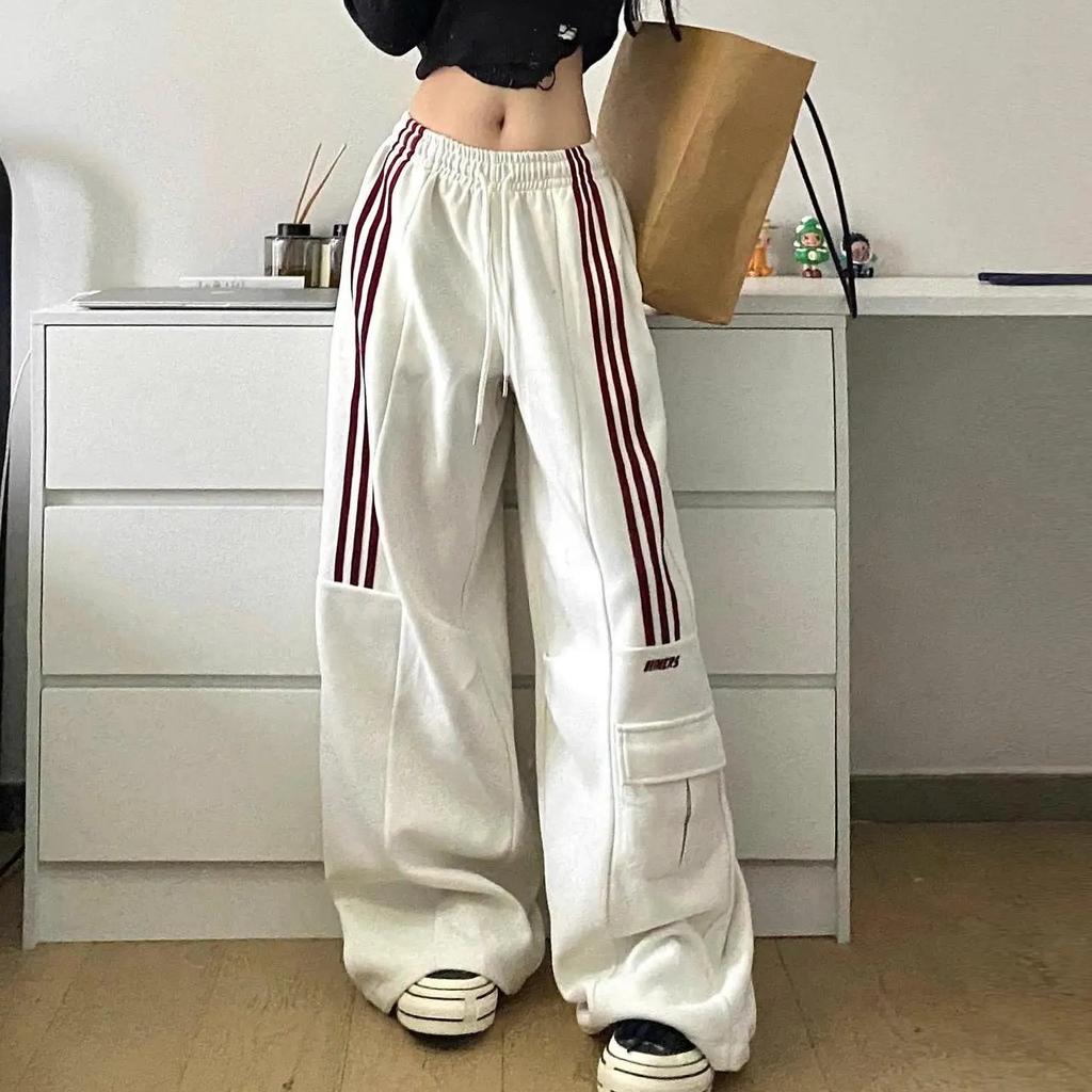 Trendy Y2K women's baggy cargo trackpants, perfect for streetwear, with distinctive side stripes for a cool look.