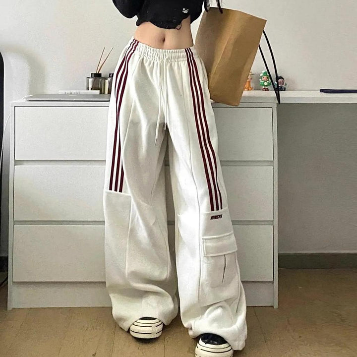 Trendy Y2K women's baggy cargo trackpants, perfect for streetwear, with distinctive side stripes for a cool look.