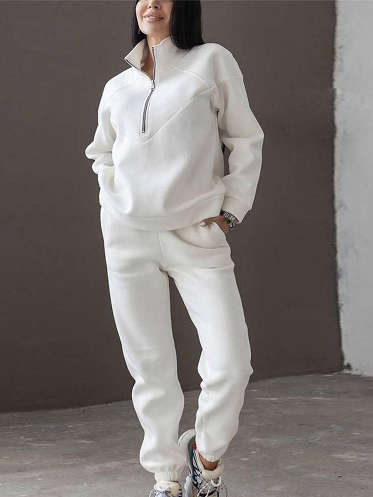 Comfortable women's lounge wear tracksuit. This zip neck two-piece is perfect for travel, leisure, and casual style.