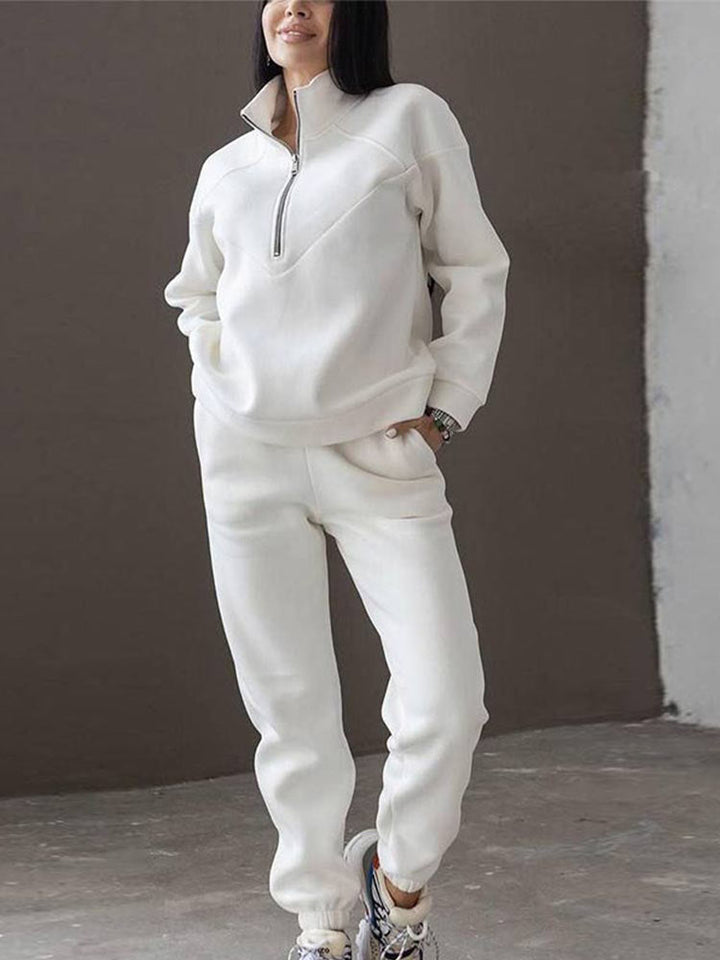 Comfortable women's lounge wear tracksuit. This zip neck two-piece is perfect for travel, leisure, and casual style.