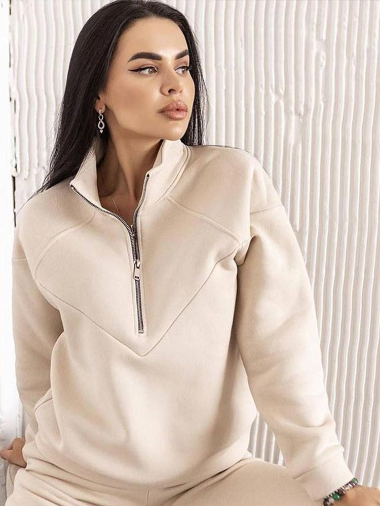 Effortless women's zip neck tracksuit set. Enjoy a comfortable, stylish two-piece for casual, athletic, or everyday wear.