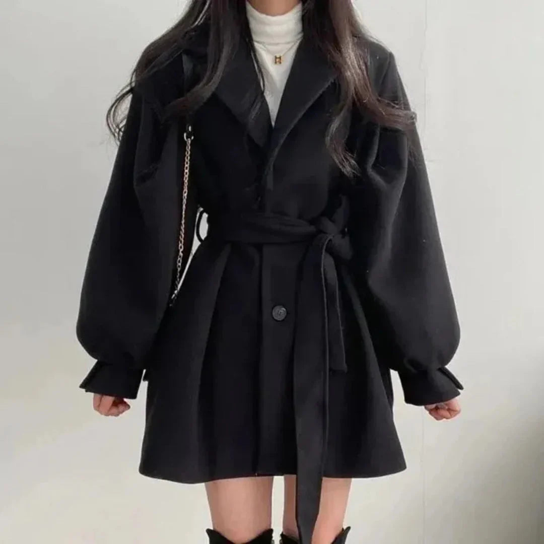 Versatile women's oversized trench coat with belt & lapel. Ideal smart casual outerwear for spring & fall.