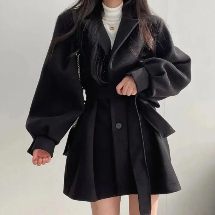 Stylish oversized A-line trench coat for women, with a belted waist & elegant lapel. Perfect fall fashion.