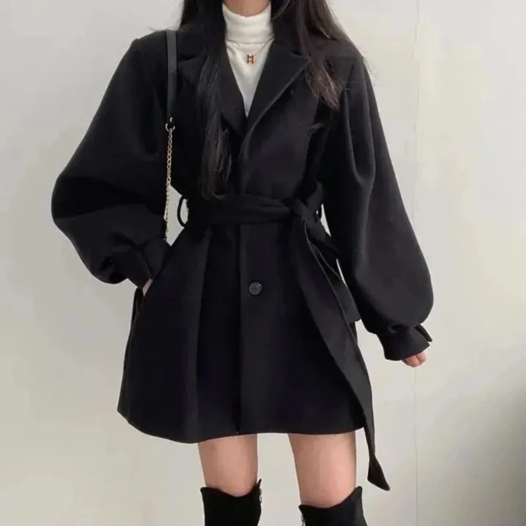 Apricot oversized belted trench coat with classic lapel & puff sleeves. Essential women's fall/spring jacket.