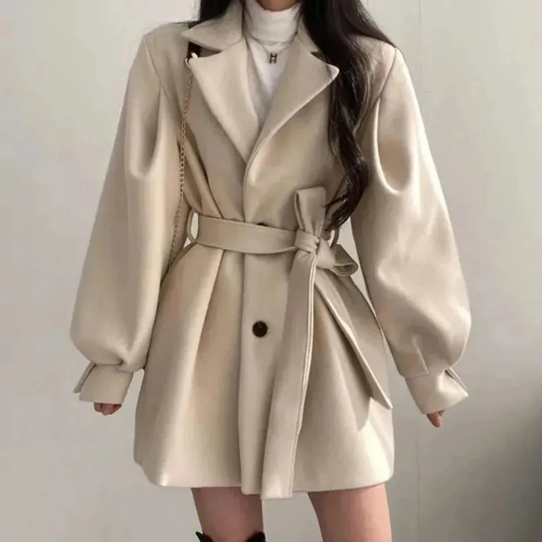Women's oversized belted trench coat with lapel & puff sleeves. Perfect spring/fall outerwear.