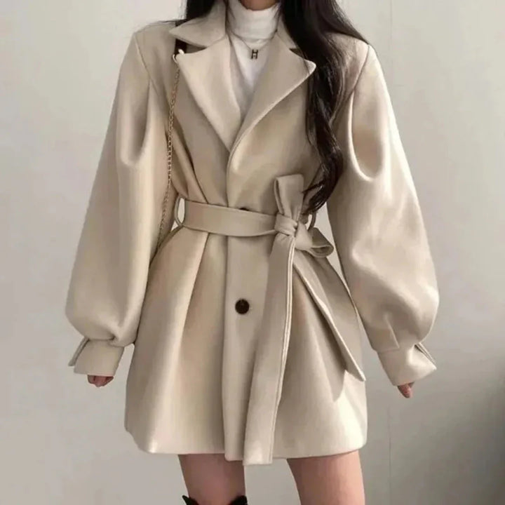 Women's oversized belted trench coat with lapel & puff sleeves. Perfect spring/fall outerwear.