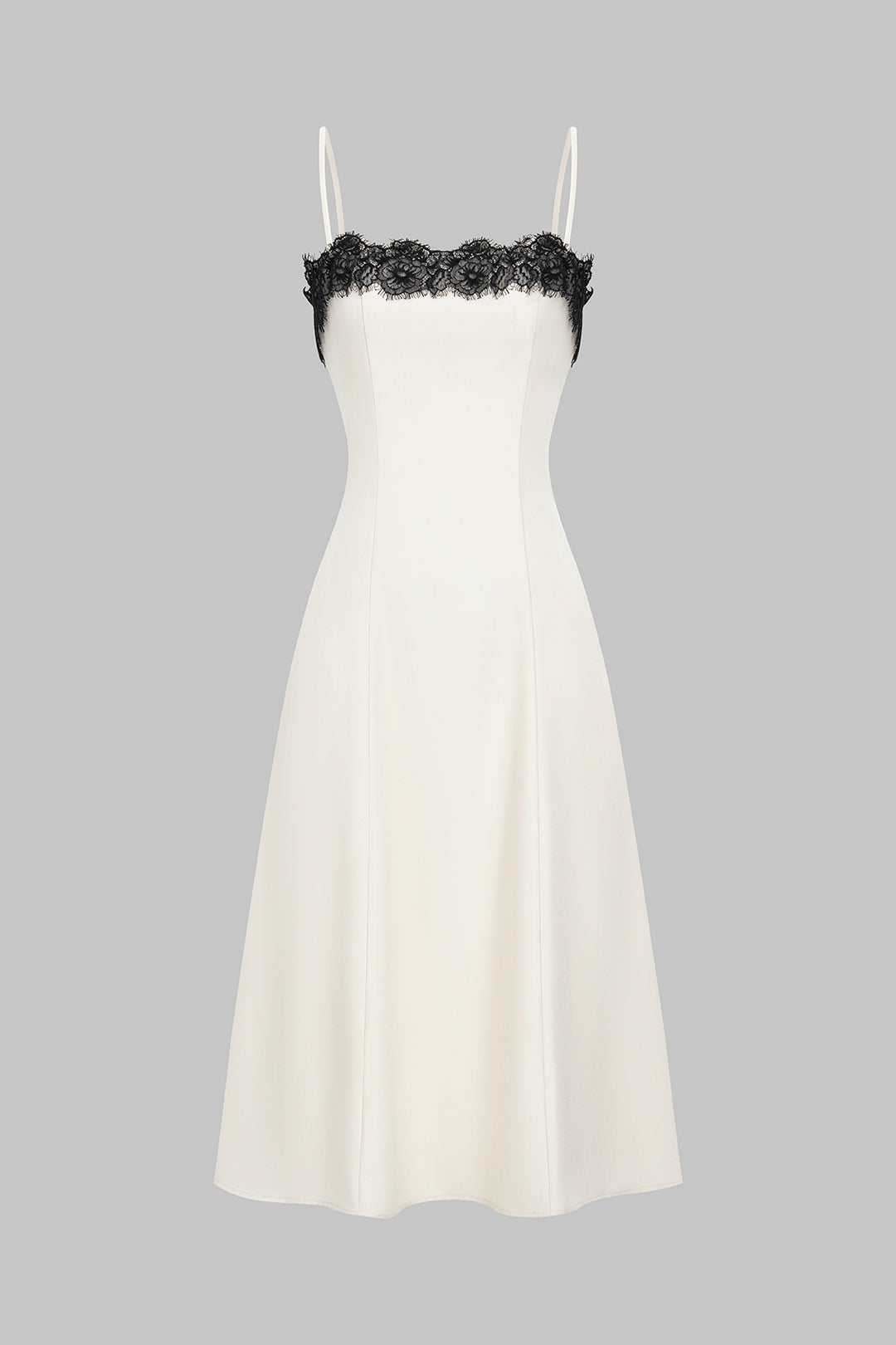 Women's white midi dress with elegant black lace detail, perfect for evening glamour or cocktail parties.