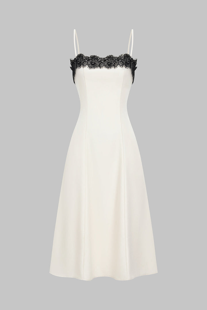 Women's white midi dress with elegant black lace detail, perfect for evening glamour or cocktail parties.