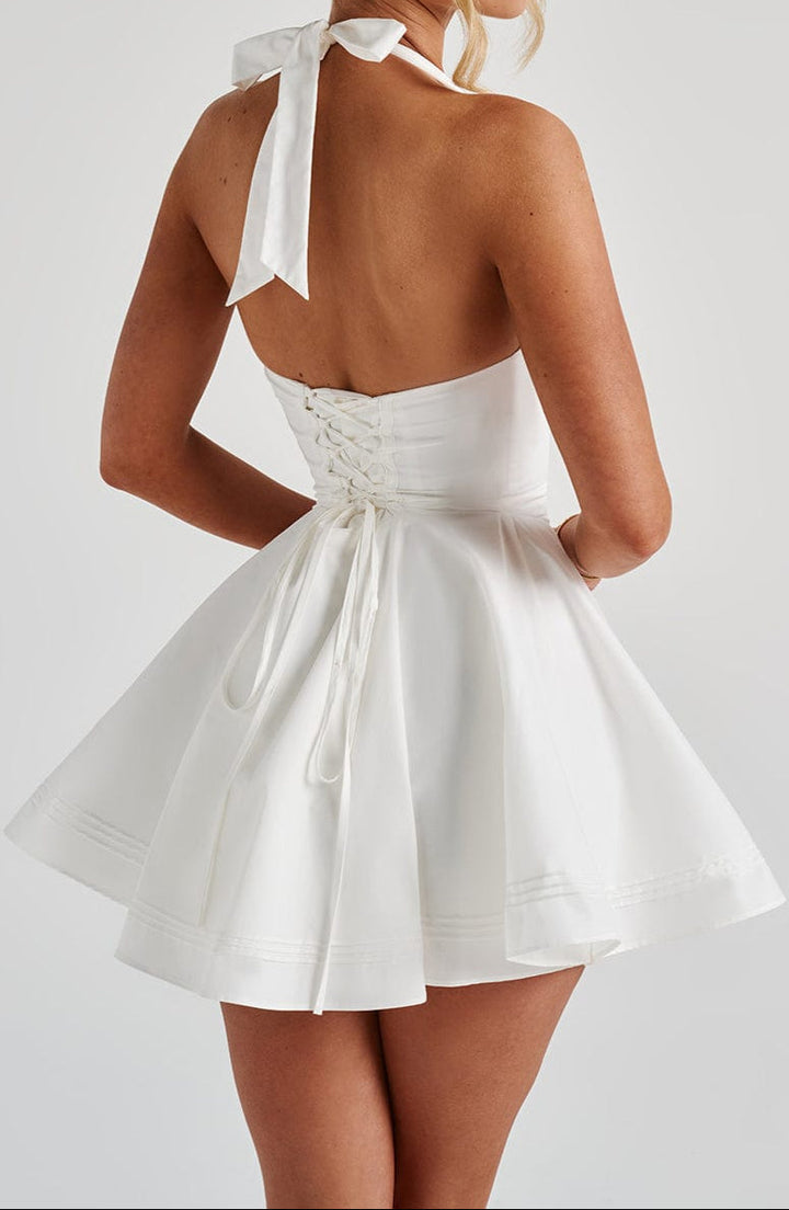 Women's V-neck white mini dress with a stylish halter neck. Elegant party & evening wear.