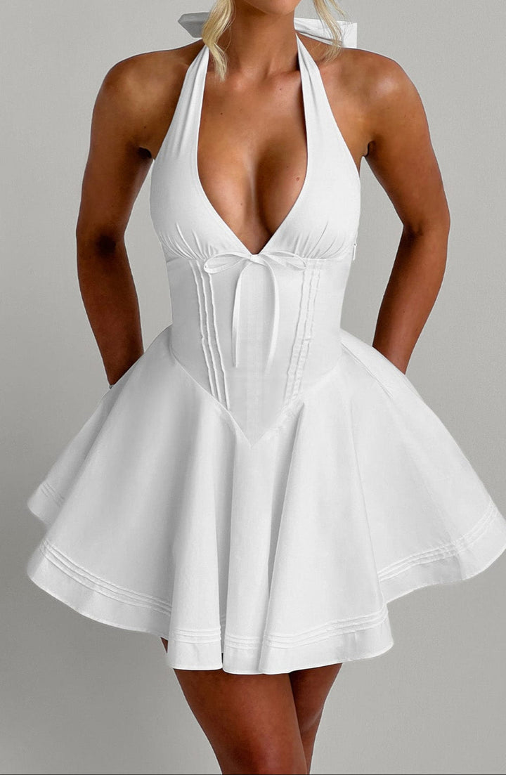 Stunning white sleeveless mini dress, perfect as a chic party or special occasion cocktail dress.