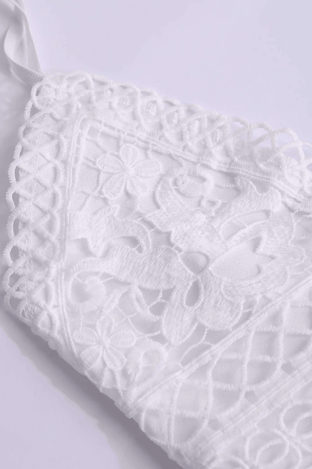 Stylish women's white mini dress with a V-neck and delicate ruffle details, suitable for elegant parties or summer events.