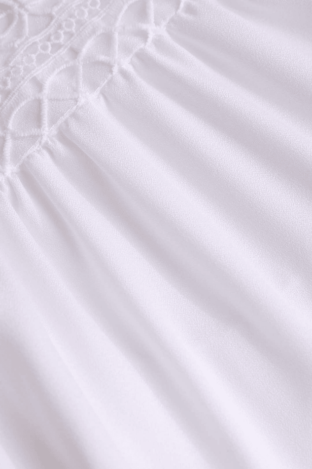 Chic women's white summer mini dress with a V-neckline and elegant ruffles, perfect for warm weather fashion.
