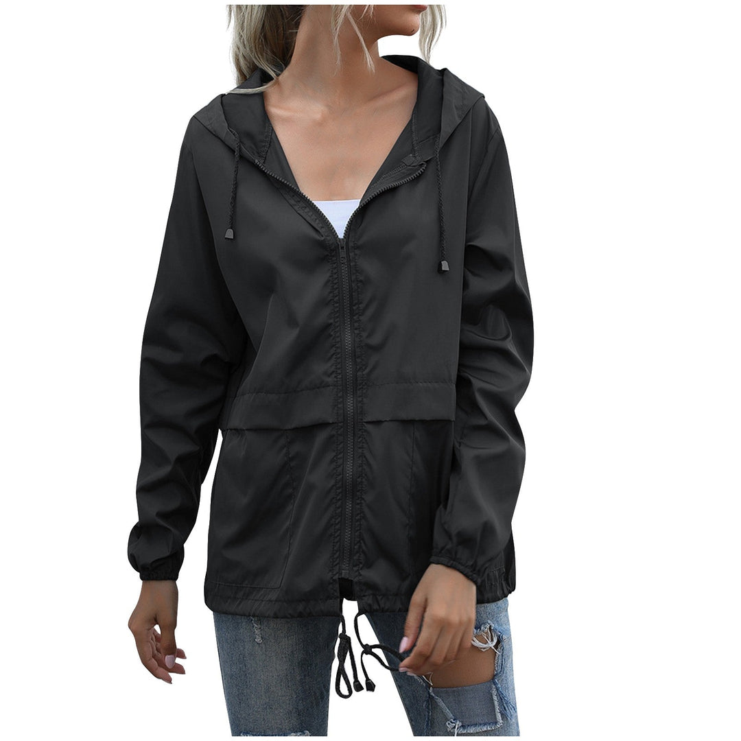 Comfortable women's lightweight windbreaker jacket with hood. Provides protection for casual outdoor and everyday wear.