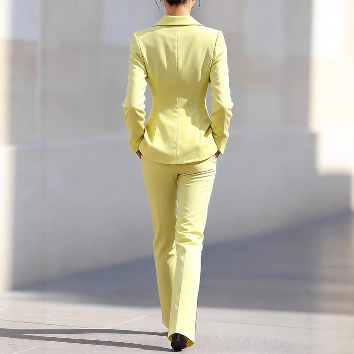 Elegant women's yellow co-ord set with tailored blazer & trousers, perfect for sophisticated office and formal wear.