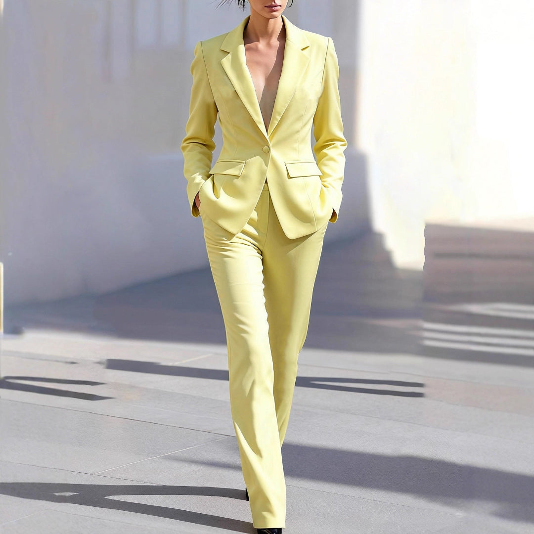 Women's tailored yellow workwear two-piece set, featuring a stylish blazer and matching trousers for professional business attire.