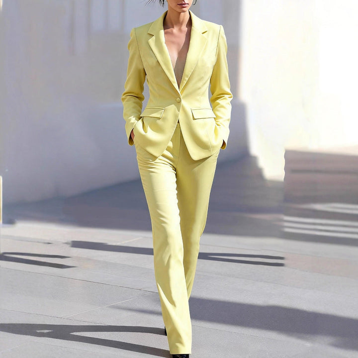 Women's tailored yellow workwear two-piece set, featuring a stylish blazer and matching trousers for professional business attire.