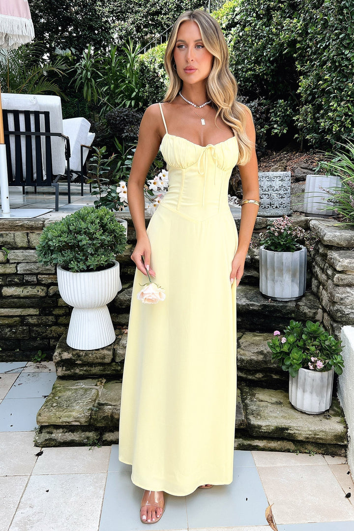 Vibrant yellow flowing maxi dress for women. Perfect summer casual sun dress, ideal for holidays & warm weather.
