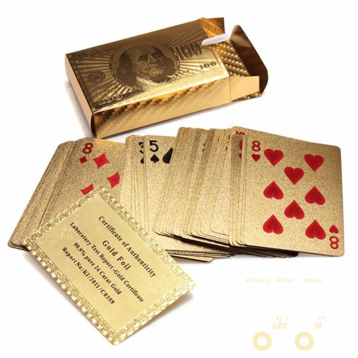 Fanned out deck of shiny 24K gold-plated playing cards, showcasing the premium collectible card deck.