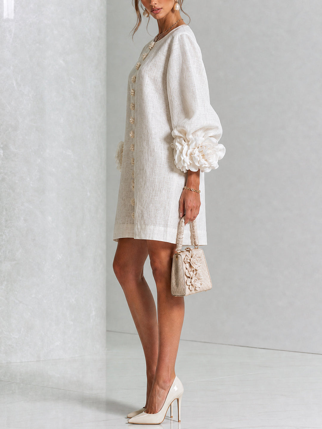 Chic women's mini shift dress with puff sleeves & button front, versatile for day wear.