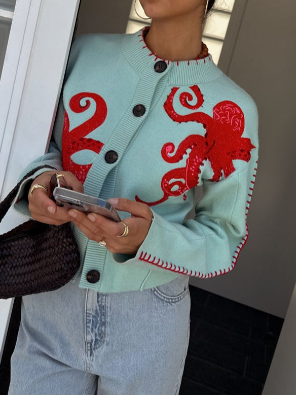 Women's light green cardigan with a unique octopus graphic, a versatile casual layering piece.