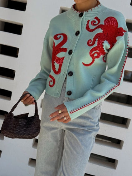 Long-sleeve women's cardigan with a playful light green octopus graphic, great for autumn fashion.