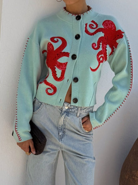 Playful women's light green cardigan, showcasing a distinctive octopus graphic for unique style.