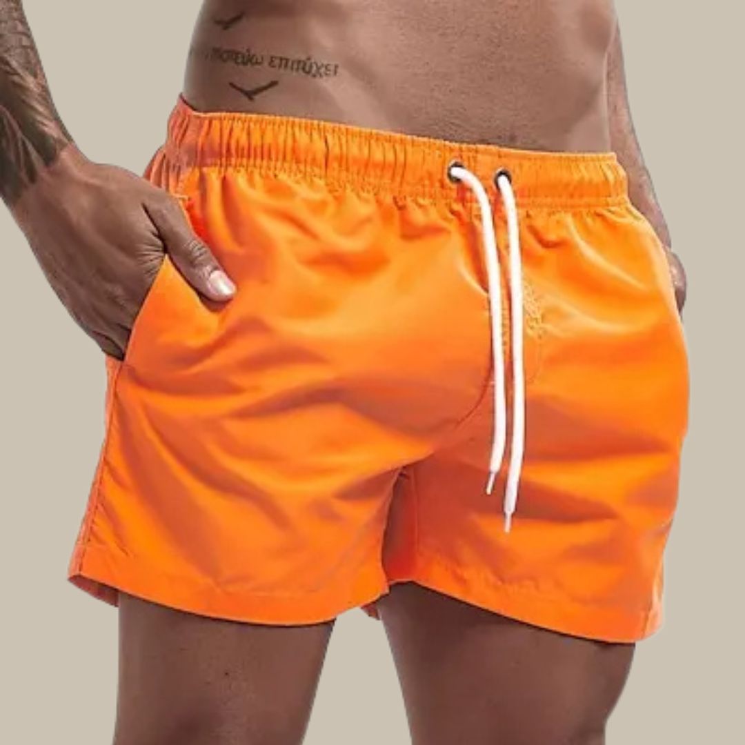 Quick-dry men's beachwear swim shorts. Durable pool shorts for summer active wear & holidays.