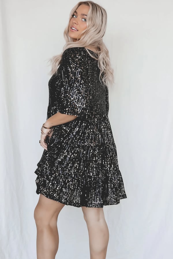 Shiny sequined A-line cocktail dress for women, versatile for parties & glamorous evenings.