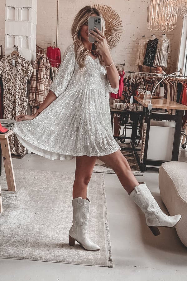 Elegant women's A-line sequin dress. Features a flattering cut & sparkling shimmer.