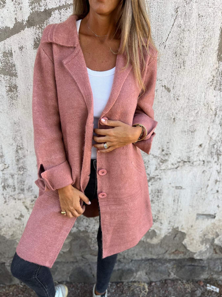 Close-up of elegant buttons on a women's long autumn coat. Classic & stylish fall fashion details.