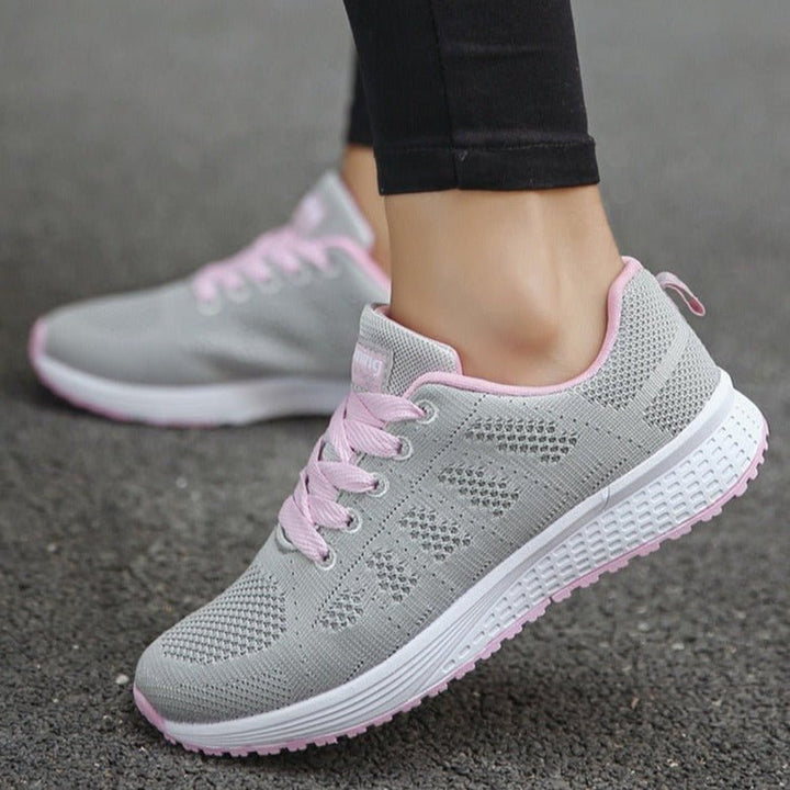 Ergonomic women's orthopedic sneakers in pink, providing excellent arch support for comfortable everyday wear.
